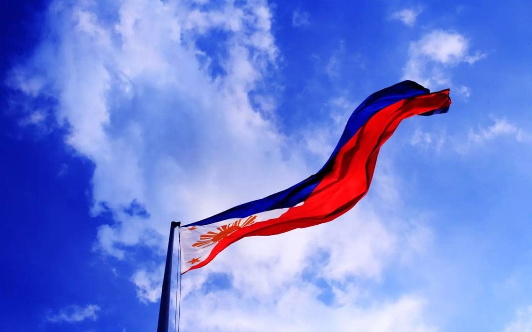 A Filipino flag flapping in the wind.